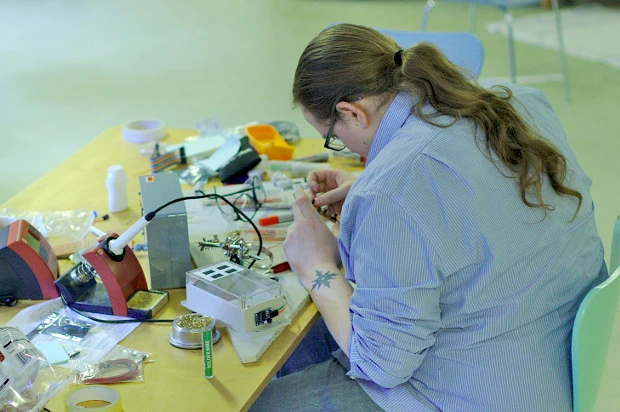 Hard at work soldering at the Eden of Things project